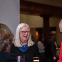 Faculty chat over appetizers